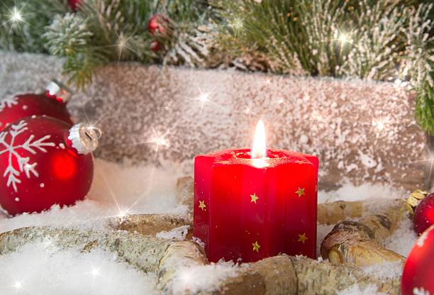 istock Rustic lantern with candlelights for christmas - classic in red. 453238239