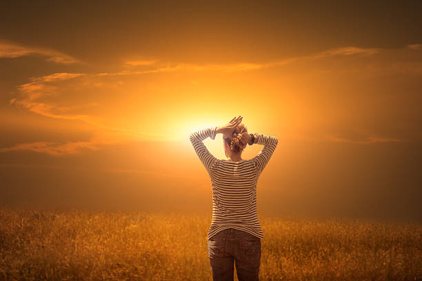 Strong woman, winning, success, and life goals concept. Young woman looking up to the sky