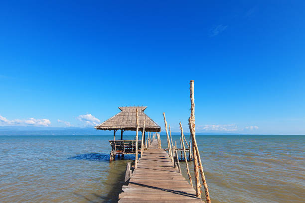 istock Wooden pier stretching into the sea 453242415