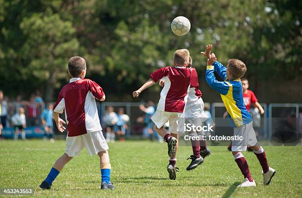 Duel In The Air Stockfoto und mehr Bilder von Kind - Kind, Fußball, Fußball-Spielball