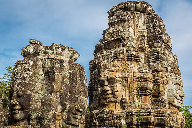 Giant stone faces bas-relief at the temple tower of Angkor Thom, Angkor Wat, Cambodia, South East Asia.