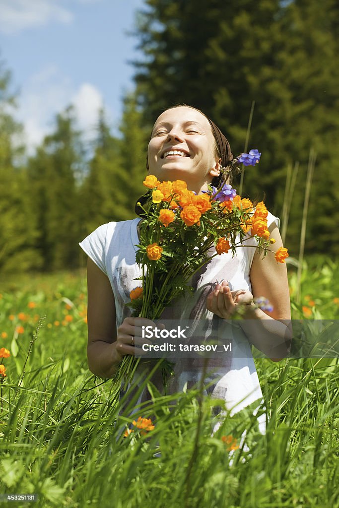 young woman with flowers Activity Stock Photo