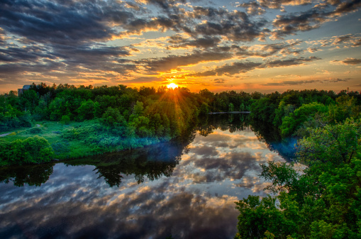 Sunset reflections on the Rideau River as seen at Hunt Club Road in Ottawa South