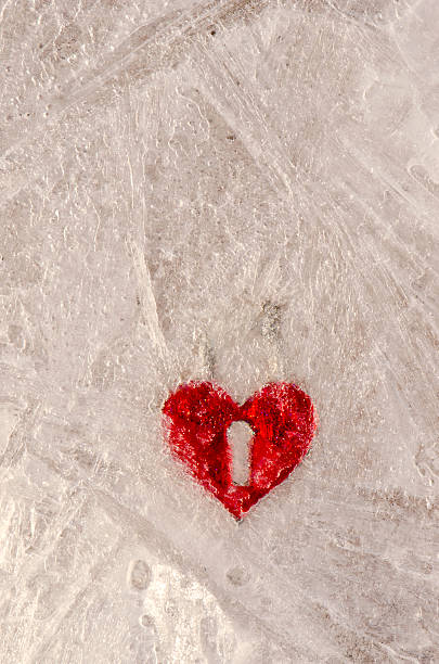 istock red heart form frozen in winter ice 453254327