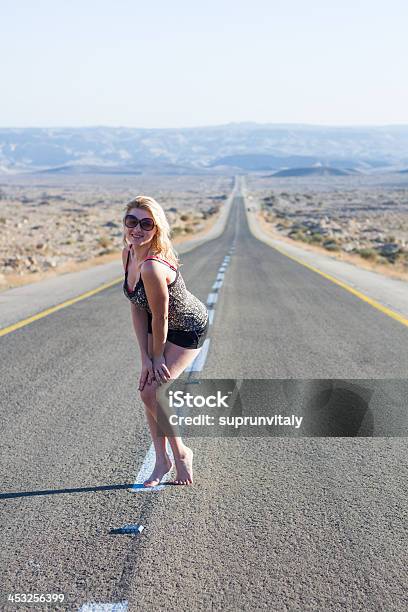 Beautiful Young Woman On A Road Stock Photo - Download Image Now - Adult, Adventure, Beautiful People
