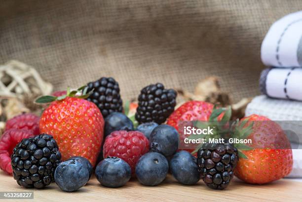 Fresh Summer Berries In Rustic Kitchen Setting Stock Photo - Download Image Now - Berry Fruit, Blackberry - Fruit, Blueberry