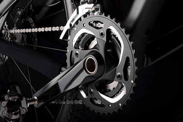 Bike chainset with chain on black background Bike chainset with chain on black background chainring stock pictures, royalty-free photos & images