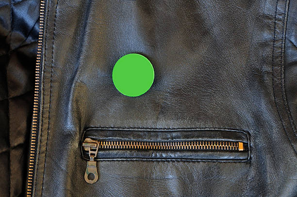 black leather jacket with pin badge Black leather jacket with zipper and blank pin badge to add your own text or logo. campaign button photos stock pictures, royalty-free photos & images