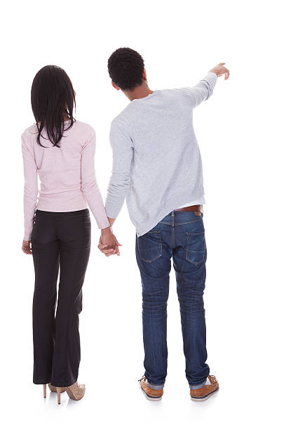 istock Back View Of Young Couple Pointing 453276271