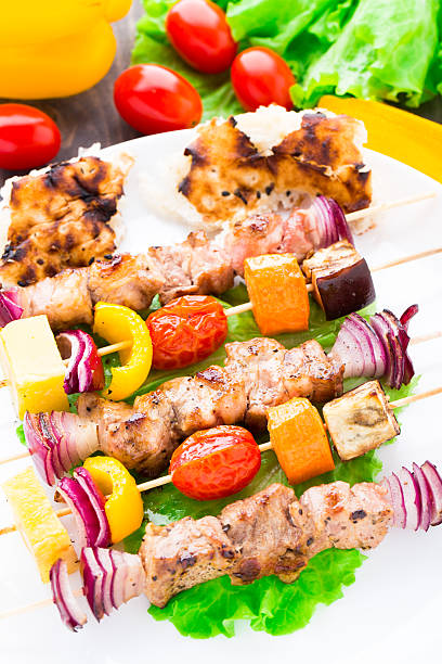 istock Barbecued pork and vegetable kebabs 453283235