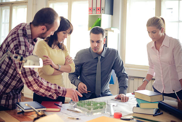 istock Group of architects discussing in an office 453283345