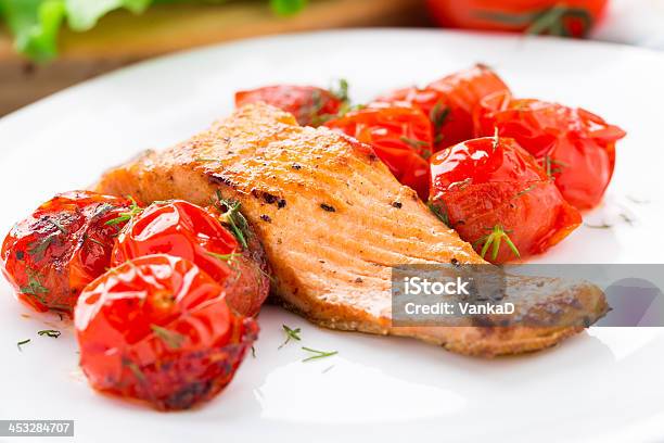 Salmon With Roasted Tomatoes Stock Photo - Download Image Now - Cherry Tomato, Cooked, Cooking Oil