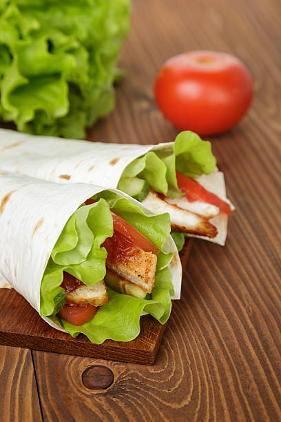 istock wheat tortilla with chicken and vegetables 453292241