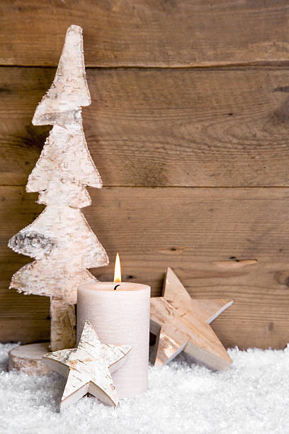 istock Christmas decoration:wooden tree candle and snow 453292635