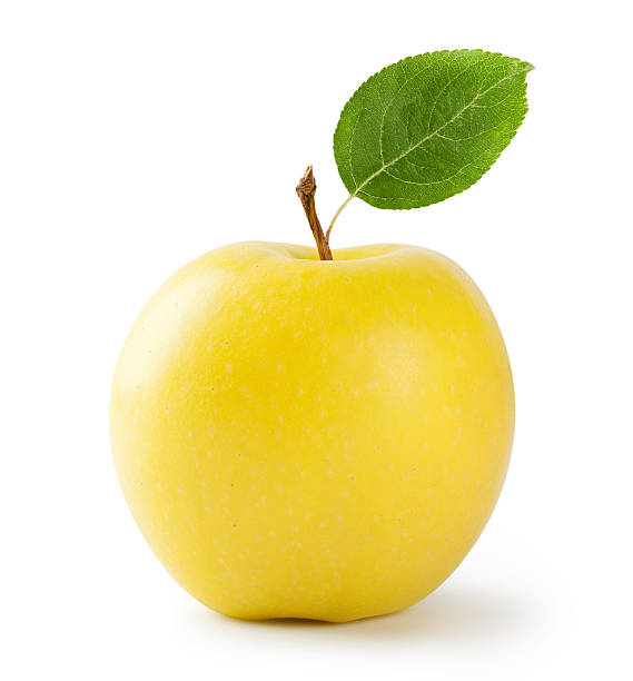 Ripe yellow apple with leaf stock photo