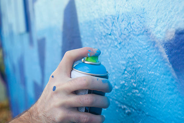 Hand Holding a Spray Paint Can stock photo