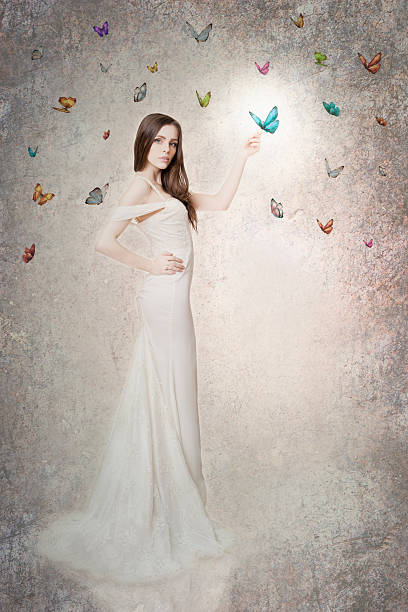 istock Beautiful bride with butterflies 453304181