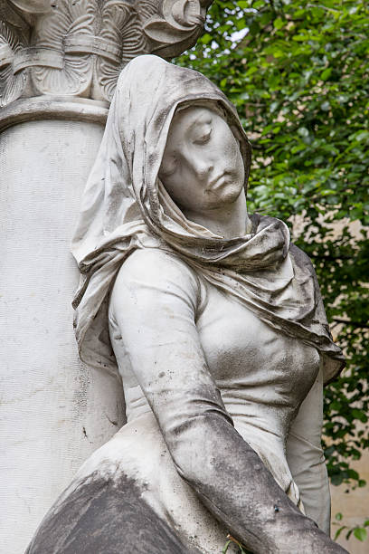 istock Grieving Statue in Pare la Chaise Paris 453304235