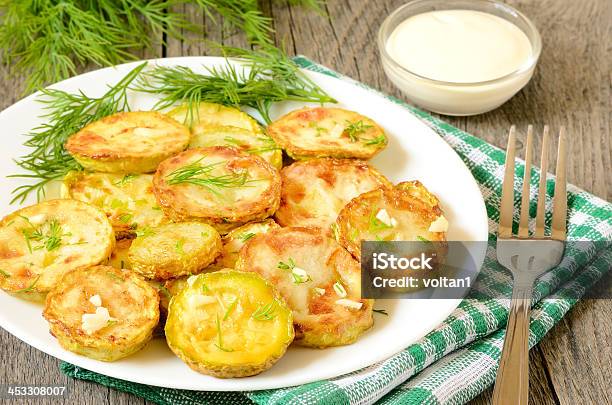 Fried Zucchini With Dill And Garlic Stock Photo - Download Image Now - Appetizer, Circle, Cooked