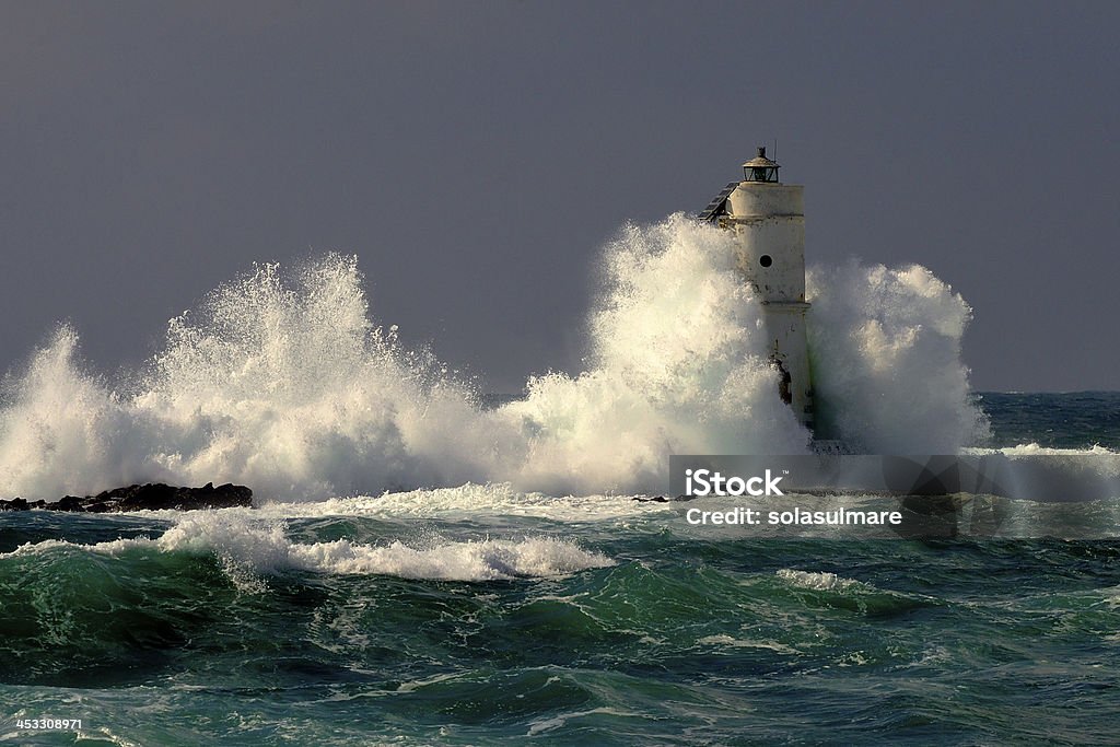 Lighthouse Lighthouse Mangiabarche situated in the south of Sardinia. Italy Lighthouse Stock Photo