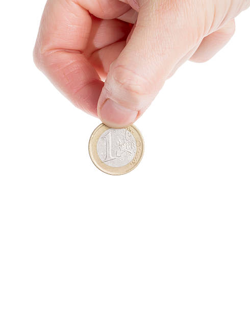 istock Female hand holding an euro coin 453309033