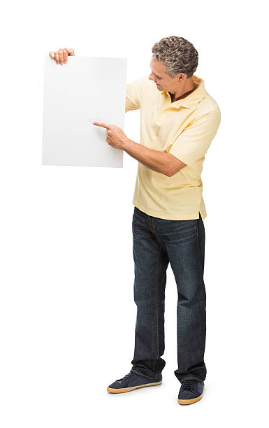 istock Mature man pointing at sign 453312667