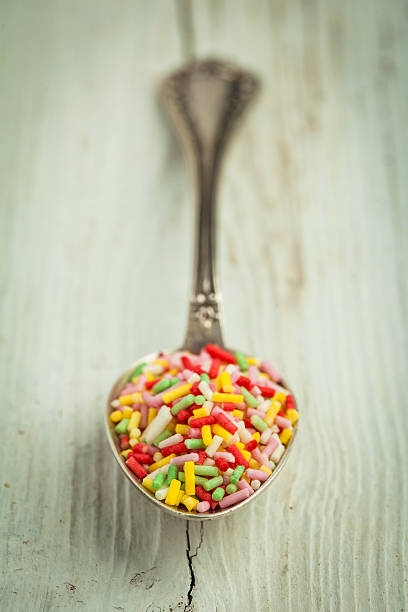 istock Colorful sugar candies on a spoon 453313727