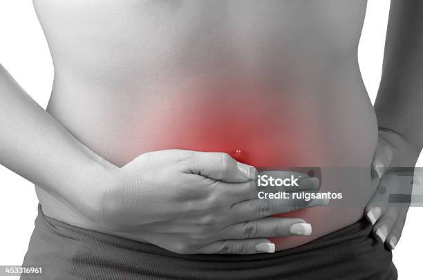 Woman Holding Her Stomach Which Is Glowing Red Stock Photo - Download Image Now - Chronic Illness, Pain, Abdomen