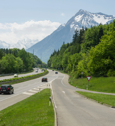 motorway against the backdrop of mountains sunny day, Switzerland