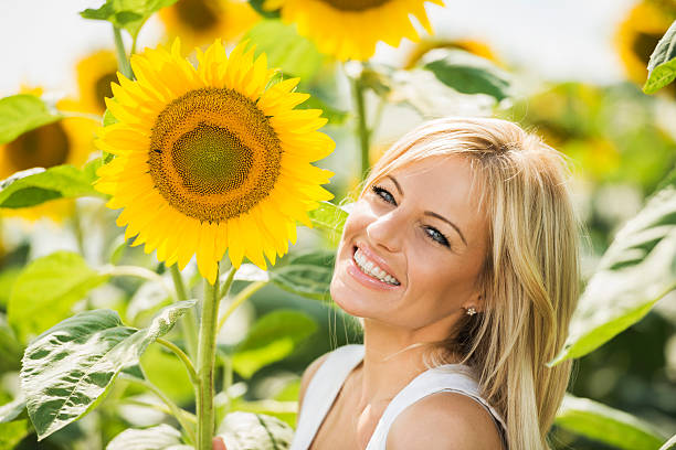 istock Beautiful woman with sunflower. 453319691
