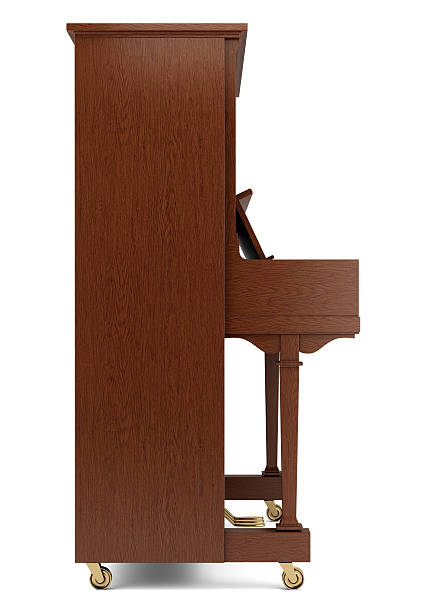 side view of brown piano isolated on white background