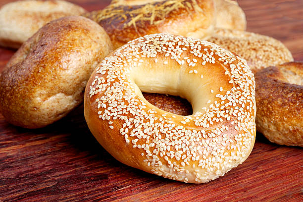 istock sesame bagel on wood 453379379