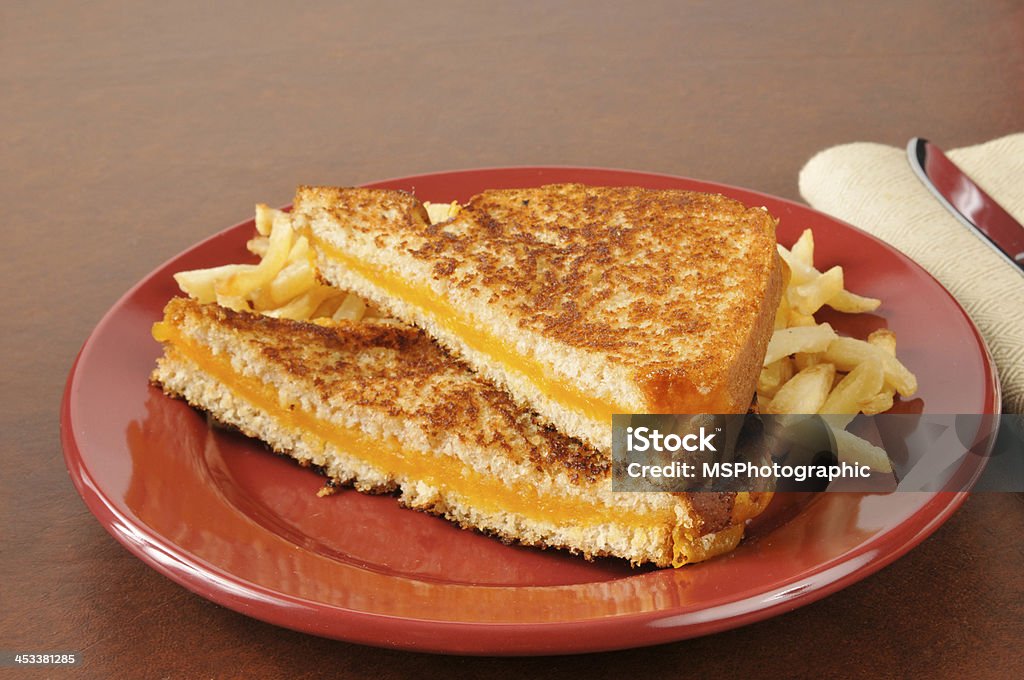 Grilled cheese sandwich A grilled cheese sandwich with french fries Cheese Stock Photo