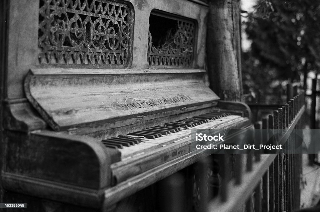 Old piano in black and white on HP5 film Nikon Antique Stock Photo