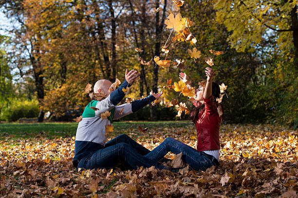 istock Couple Playing In The Leaves 453396391