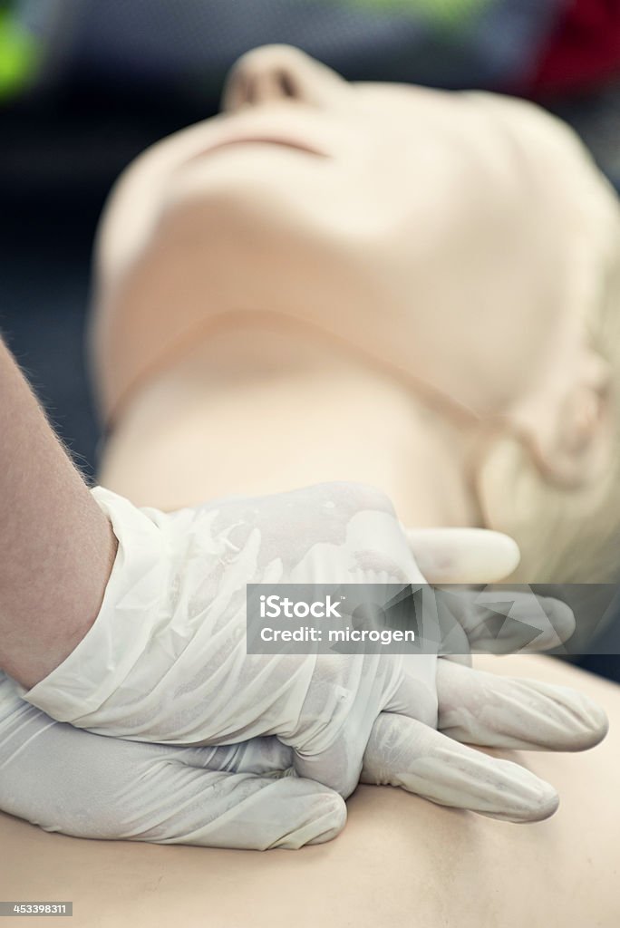 CPR chest compressions CPR - Demonstrating chest compressions on CPR dummy CPR Stock Photo