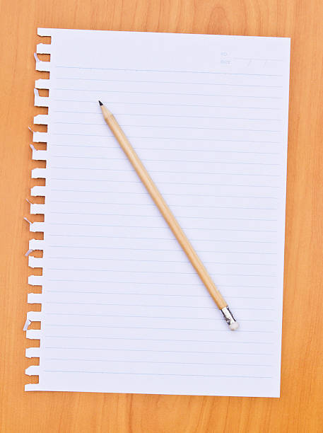 istock white paper and pencil on wood background 453404201