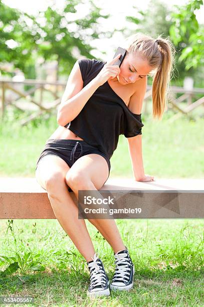 Young Cute Woman Talking On The Phone In City Park Stock Photo - Download Image Now - Adult, Adults Only, Agricultural Field