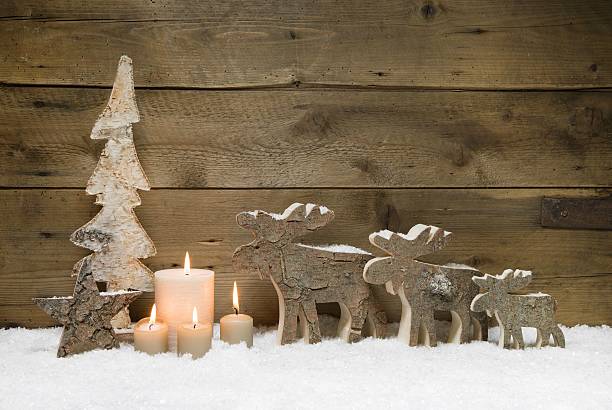 istock Wooden Christmas tree with elk or reindeer and candles. 453405571