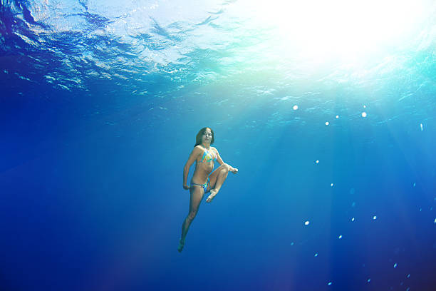 istock beauty dancing in the sea - underwater shot 453405863