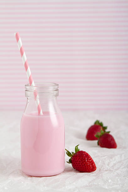 istock Strawberry milk in retro bottle vertical 453409341