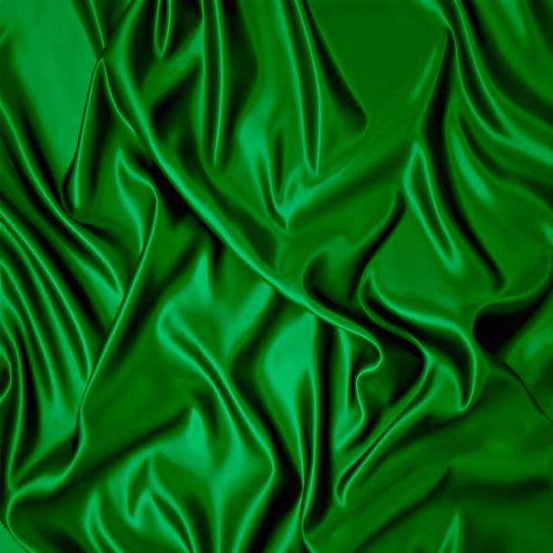 istock Green silk cloth with folds. 453411195