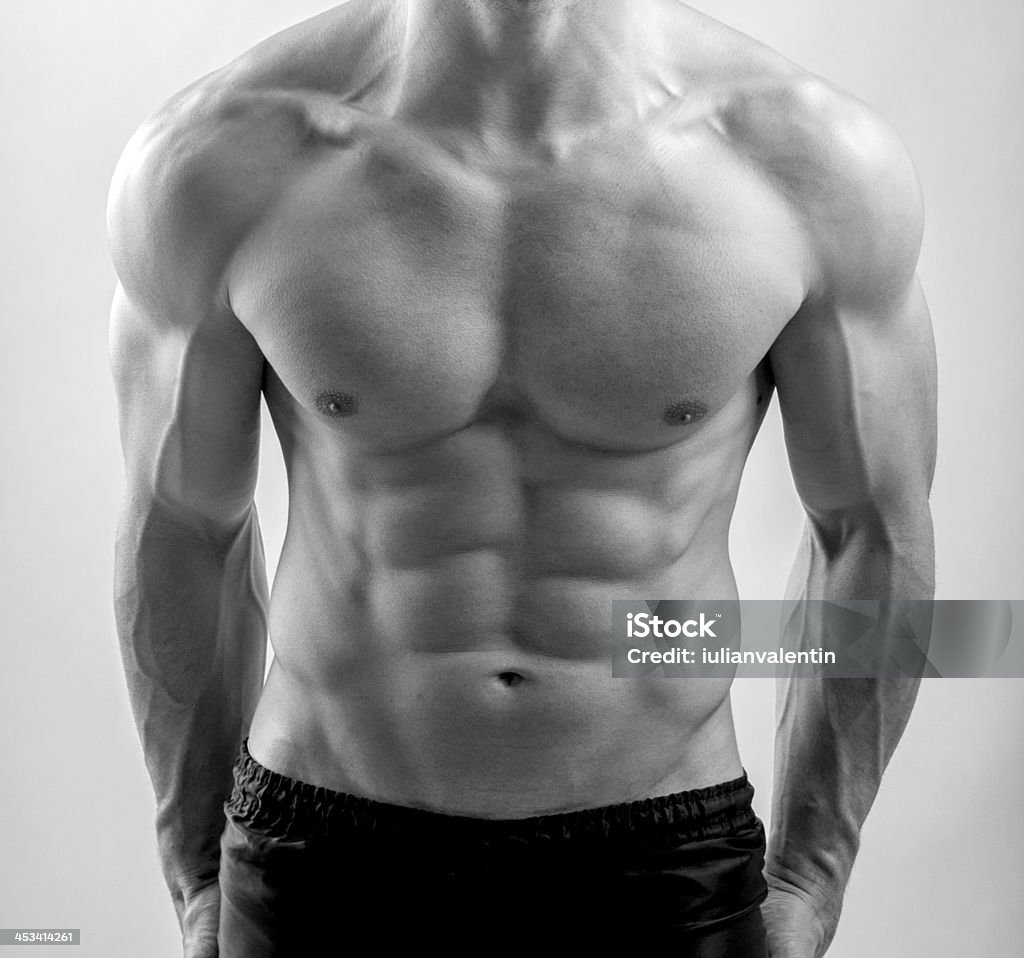 Close up on perfect abs. Strong bodybuilder with six pack Abdomen Stock Photo