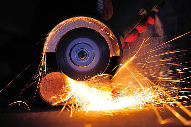 istock Worker cutting metal with grinder 453415479