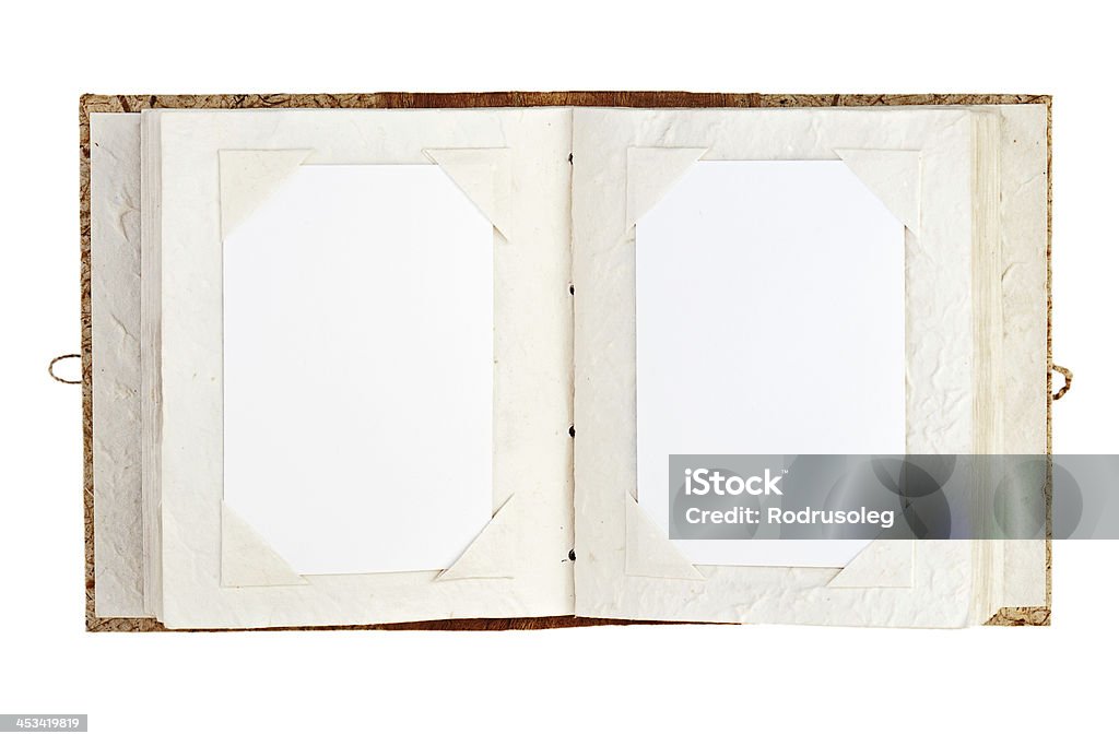 Open old photo album with place for your photos isolated Open old photo album with place for your photos isolated on white background. Closeup. Open Stock Photo