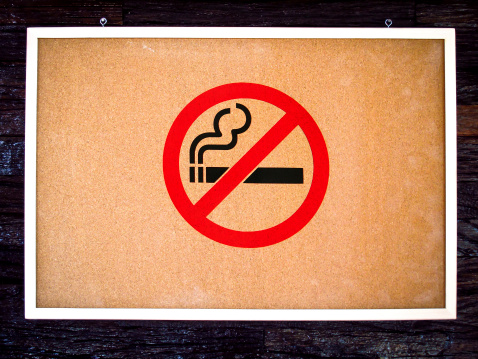 No smoking sign on wooden board