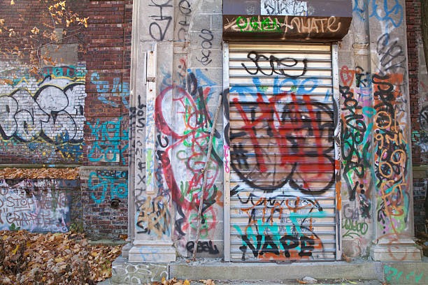 Graffiti on abandoned building Graffiti on abandoned building in New York City graffiti brick wall dirty wall stock pictures, royalty-free photos & images