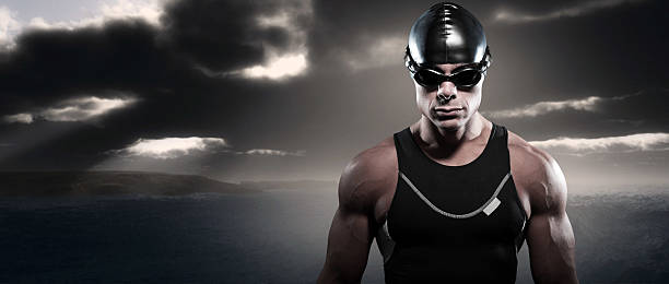 istock Swimmer triathlon man with cap and glasses outdoor. 453431451