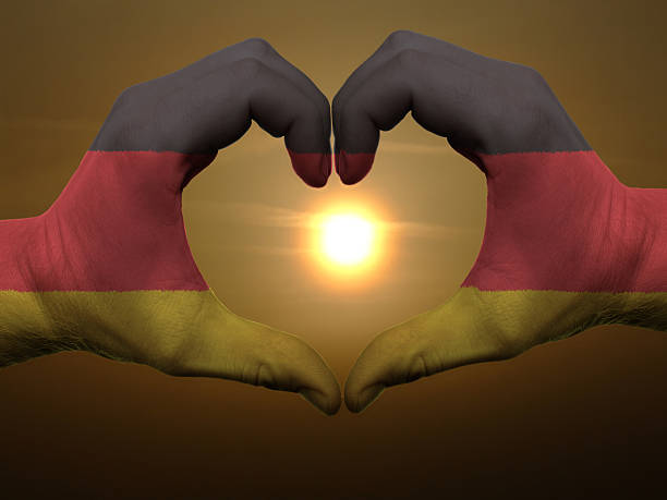 istock Heart and love gesture by hands colored in germany flag 453434321