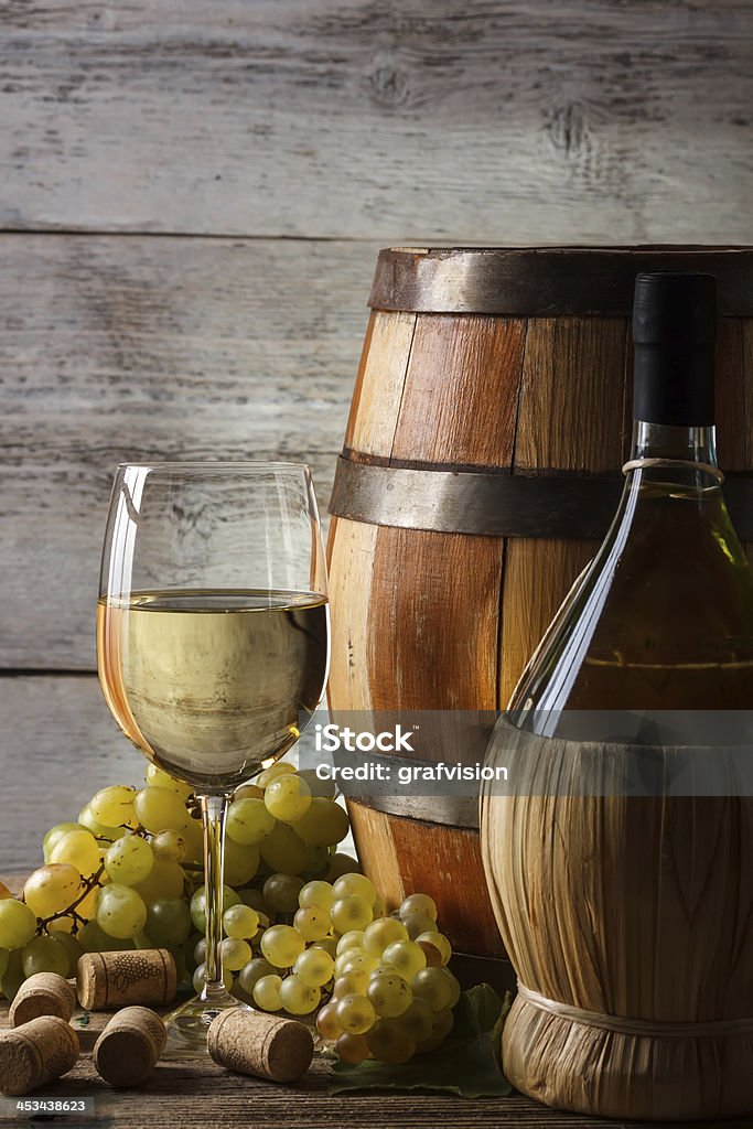 White wine White wine still life with fresh grapevine Barrel Stock Photo